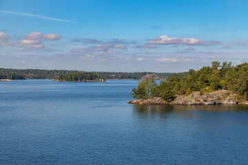 Stockholm Archipelago, view from the cruise ship. Rocks with trees.