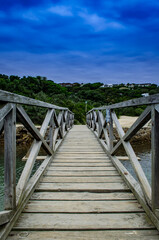 Fototapeta na wymiar wooden bridge over the river, moody 