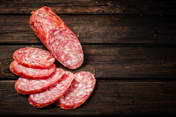 Sliced delicious salami sausage on the table. 