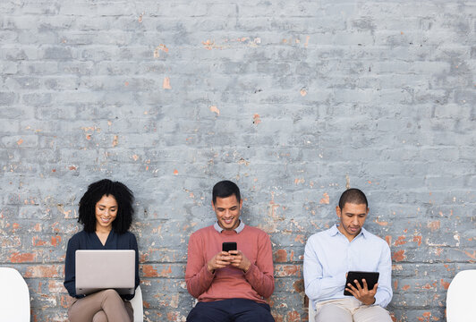 Diversity, recruitment or business people waiting at startup company, job interview or hiring team. Teamwork, mockup wall or employee for cyber security, technology collaboration or programmer work