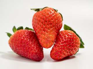 Ripe strawberries on a white background. Strawberries close up.