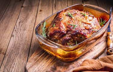 Roasted pork meat with potatoes, rosemary and beer sauce