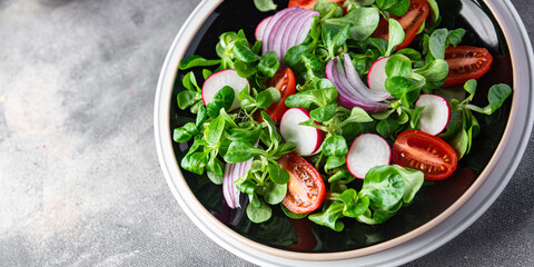 vegetable salad tomato, radish,  mache lettuce, green leaves snack fresh meal food on the table copy space food background rustic top view