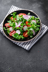 vegetable salad tomato, radish,  mache lettuce, green leaves snack fresh meal food on the table copy space food background rustic top view
