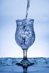 The image of pouring drinking water, into a glass,