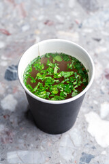 Broth, Chicken soup in a paper cup. Food delivery