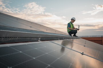 Service engineer checking solar cell on the roof for maintenance if there is a damaged part. Engineer worker install solar panel. Clean energy concept.