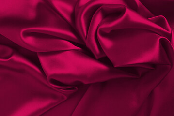 Viva magenta silk or satin luxury fabric texture can use as abstract background.