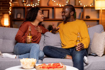 Black couple in love having date at home