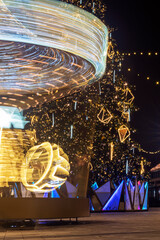 Blur moving light of Carousel in amusement park. Carousel motion effect.