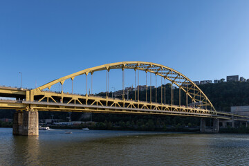 Fototapeta na wymiar Fort Pitt Bridge and Monongahela River in Pittsburgh in Pennsylvania. Sunset Sky and Light.