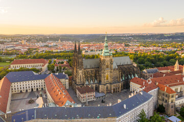 Fototapeta na wymiar Sunset in Prague Old Town with St. Vitus Cathedral and Prague castle complex with buildings revealing architecture from Roman style to Gothic 20th century. Prague, capital city of the Czech Republic
