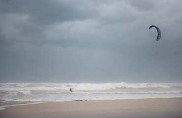 Stormy Mediterranean Sea and Cloudy Sky in Tel Aviv, Israel. Man with Power Kite