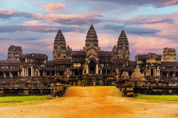 Naklejka premium Angkor Wat at sunset sean from the east gate path