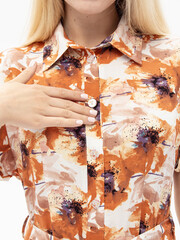 Summer wrap dress with belt on white background. Shirt dress. Buttons closeup