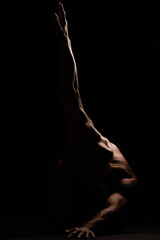 Nude, man with body and silhouette and isolated on black background, strong with muscle and skin in...