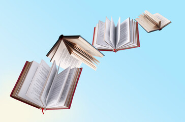 hardcover books fly on yellow and blue background