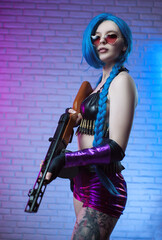 sexy girl in a bright image with a gun in her hands on a neon background