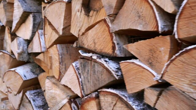 Close-up of firewood supply. Media. Lots of chopped firewood for winter. Supplies of firewood in village for winter
