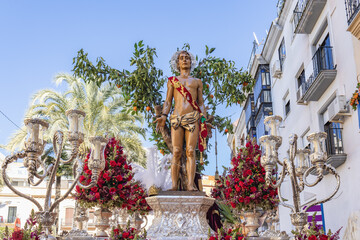 Throne or platform of the paso of Patron Saint Sebastian (San Sebastian)  in procession through the streets of the city of Huelva - obrazy, fototapety, plakaty