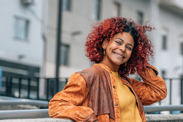 latin girl with afro hair on the street outdoors