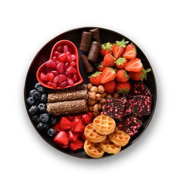 Valentines Day Charcuterie Board With Chocolate, Different Sweets,strawberries, Blueberries And Candies In Black Plate Isolated On Transparent Nackground. View From Above.