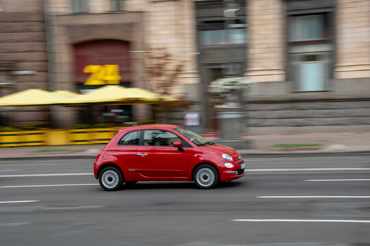 Ukraine, Kyiv - 2 August 2021: Red FIAT 500 car moving on the street. Editorial