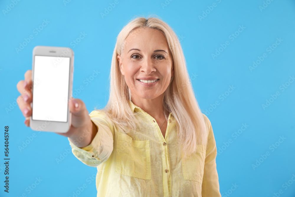 Sticker mature blonde woman with mobile phone on blue background