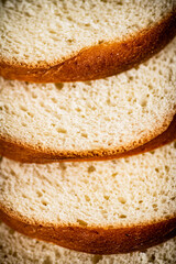 Pieces of wheat bread. Macro background. 