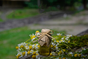 Chamomile essential oil and chamomile flowers