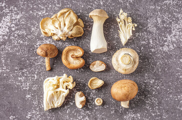Fototapeta na wymiar Composition with fresh mushrooms on grunge background