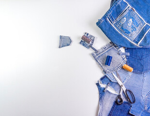 Old jeans ready to upcycling. Concept of things reuse and natural resources preserving.