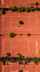 aerial view of multiple tennis courts, providing a glimpse of the vastness and organization of a professional tennis facility