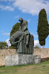 Bronze statue of Saint Francis in front of the Basilica of San Francesco in Assisi, Umbria Italy