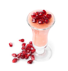 Shot of delicious pudding with pomegranate seeds isolated on white background
