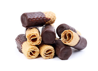 Heap of tasty chocolate wafer rolls isolated on white background