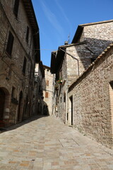 Fototapeta na wymiar Old narrow alley in Assisi, Umbria Italy