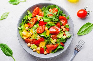 Vegetable Salad, Healthy Eating, Vegetarian Salad with Chickpeas, Avocado, Pepper, Spinach, Cherry Tomatoes in a Bowl