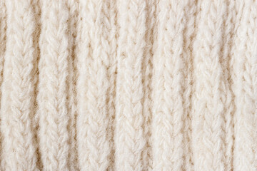 Soft knitted wool texture, warm white background, soft yarn. Loops pattern