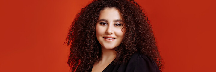 Fototapeta na wymiar Banner girl with a curly hairstyle with a gift