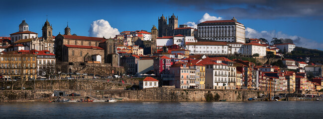 Porto, Portugal. Panoramic cityscape image, wiev from the river Douro. Historic town with colorful buildings.