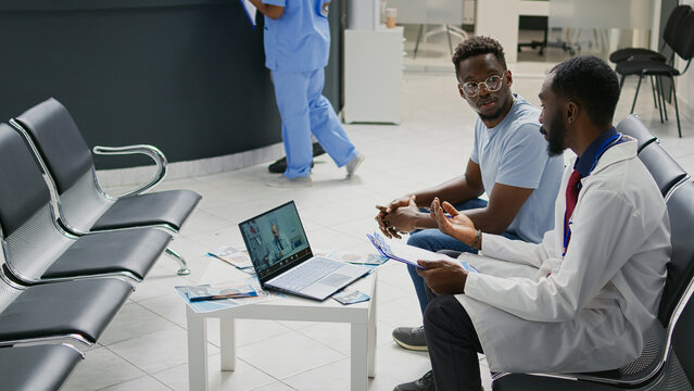 Specialist Talking On Videocall Conference With Physician, Using Online Telehealth To Chat With Webcam On Laptop. People Chatting On Remote Videoconference Telemedicine, Healthcare.