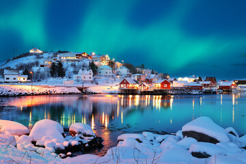 Dramatic evening cityscape of Reine town with Northern Lights. © pilat666