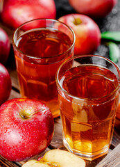 Apple juice on a wooden tray. 