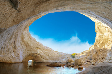 View of the volcanic open cave of Sykia, Milos island, Cyclades, Greece