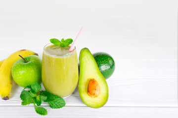 Avocado and Banana mix apple fresh cocktail smoothies fruit juice beverage healthy the taste yummy in glass drink episode good morning on white wooden background.
