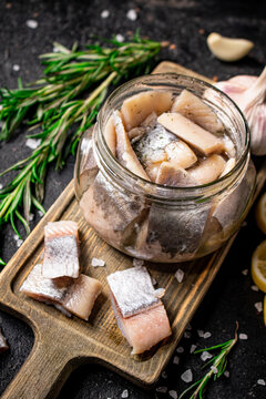 Salted herring glass jar with a swist of rosemary.