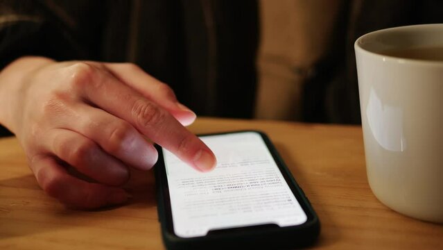 Woman chatting online on smartphone macro close up, typing text message, touching touchscreen keyboard, using messenger application. Female holding mobile phone, close up, swiping social media. 
