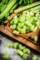 Sliced celery on a cutting board. 