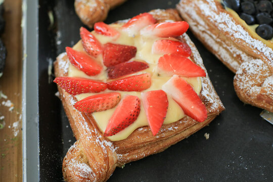 Danish dessert pastries with strawberry and custard cream. Fresh Bakery for morning  for breakfast.